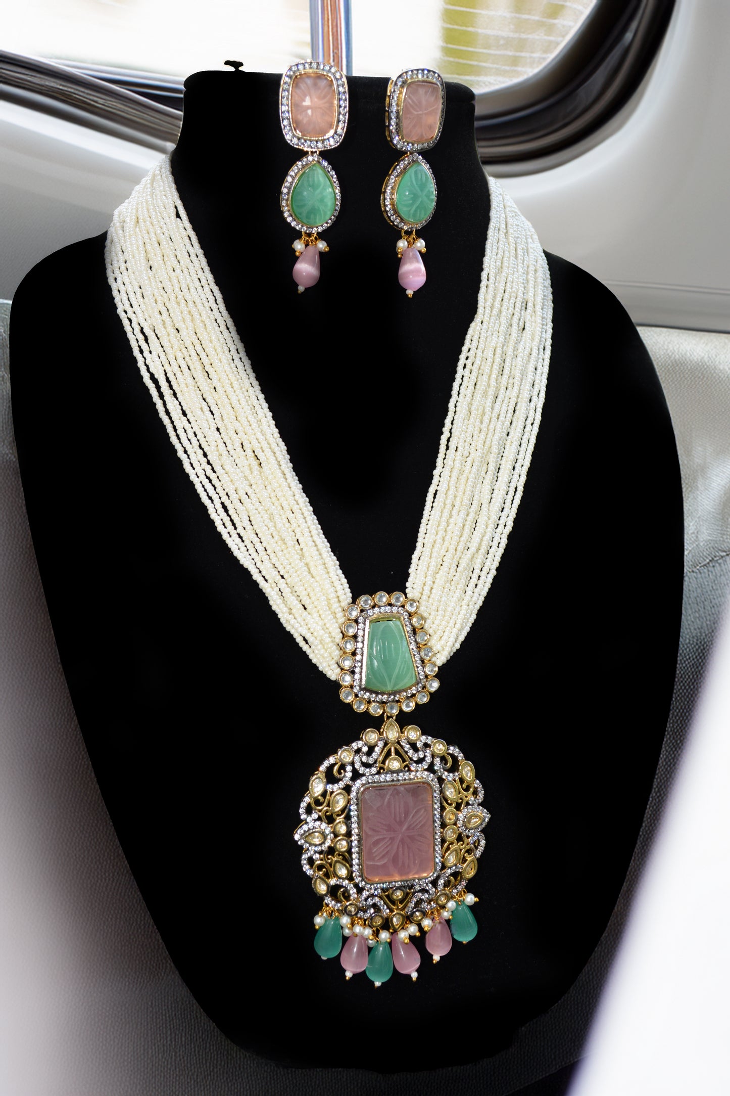 Multi-colored long beaded necklace with pendant